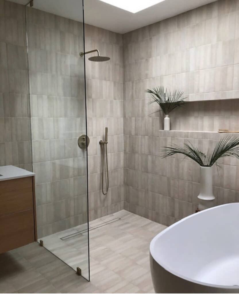 Creme tile shower wall bathroom