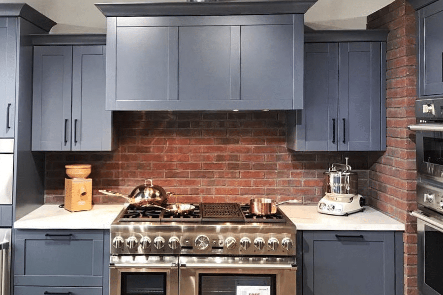 red brick in blue cabinet kitchen